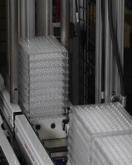 diagnostic microwell trays stacked by automation